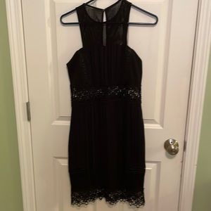 Black Express dress with mesh and eyelet details.